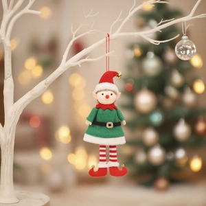 Christmas elf couple ornaments in red and green felt hanging on a white decorative branch