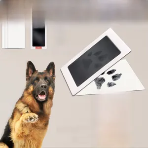 Mess-free inkless pet paw print kit showing black ink pad and white imprint cards