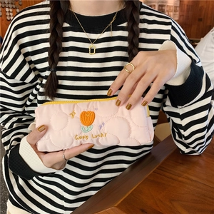 Detailed embroidered tulip on a pink quilted fabric stationery bag with Good Lucky text