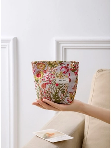 Floral jacquard travel makeup bag with colorful vintage embroidery and a hand-held design