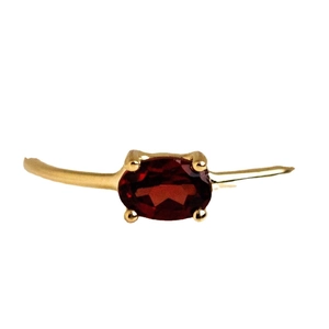 Gold-plated brass ring with oval red zircon stone in 4-prong minimalist setting