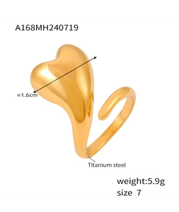 Detailed view of an 18k gold plated titanium steel heart ring with polished finish