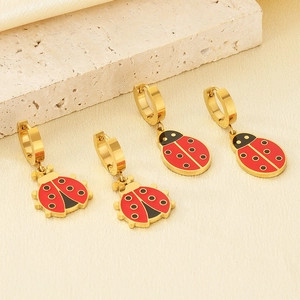 Chic gold-plated ladybug hoop earrings with red enamel on a decorative stone base