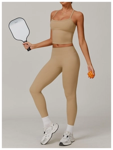 Detail view of khaki high-waisted yoga leggings and sports bra set in matte finish
