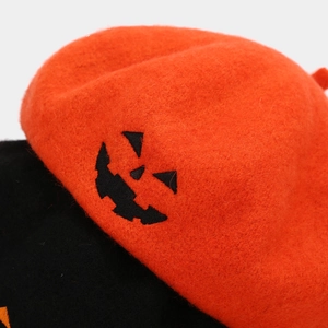 Halloween wool beret featuring pumpkin embroidery and skull motif in orange and black