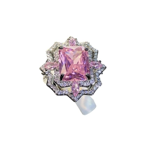 Elegant silver ring with a large pink ice-flower cut stone and surrounding crystals