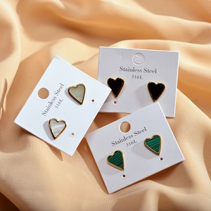 Three 316L stainless steel heart earrings with white shell, black, and green malachite inlays