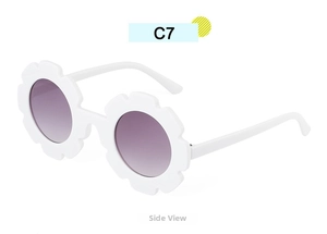 Side view of white flower petal sunglasses for kids with purple gradient lenses