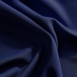 Macro detail of breathable navy blue mesh fabric showing high-density woven texture on polo shirt