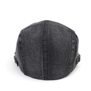Detailed back view of denim beret featuring adjustable metal buckles and stitching