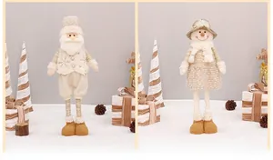 Detail of plush Santa and Snowman dolls with sequined hats and snowflake patterned vests