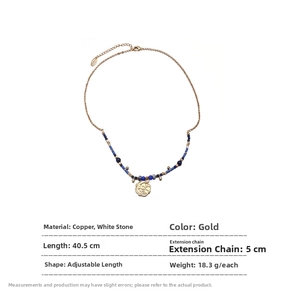 Detail of gold-plated brass necklace with blue beads and vintage coin pendant relief