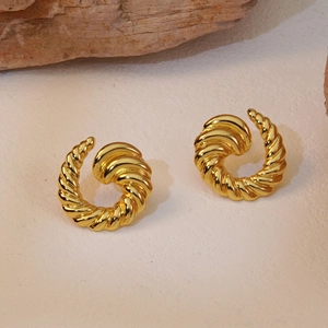 Minimalist gold spiral hoop earrings with vintage twisted metal texture and glossy finish