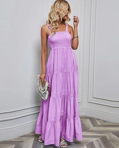Detailed close-up of lavender smocked bodice and fine vertical stripes on summer dress