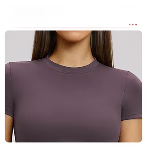 Detail of the classic round neckline on a purple slim fit moisture-wicking yoga t-shirt