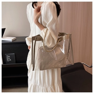 Detail of transparent PVC tote bag with thick woven hemp rope handles and inner pouch