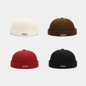 Set of four retro cotton brimless skullcap hats in beige, brown, red and black colors
