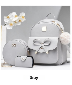 Three-piece grey PU leather backpack set with bow detail and fuzzy ball charm