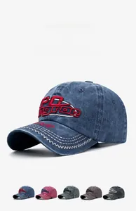 Close-up of vintage washed denim baseball cap with 3D embroidery in five various colors