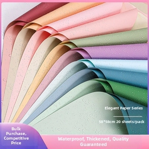 Close-up of waterproof Ouya flower wrapping paper in various Morandi colors with water droplets