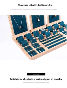 Detail view of wooden jewelry display set with teal velvet necklace and ring organizers