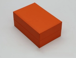 Detail of bright orange faux leather gift box for watch sets with high quality texture