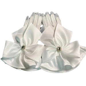 Elegant white bridal satin gloves with large lace bow and sparkling rhinestone accents