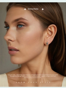 Close-up of 925 sterling silver skull earring featuring a pink gemstone eye inlay