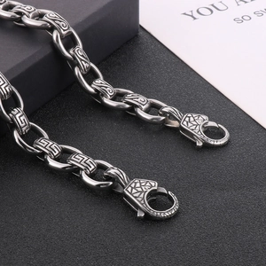 Vintage stainless steel square bracelet with engraved scroll pattern and lobster clasps