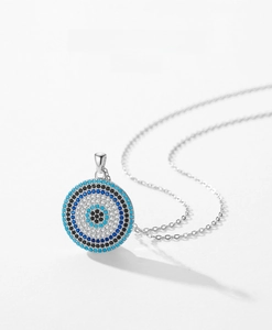 Macro detail of S925 silver Evil Eye pendant necklace with inlaid zircon stones