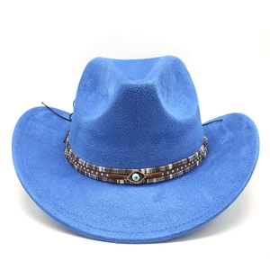 Detail of bright blue cowboy hat with woven band and blue evil eye decorative ornament