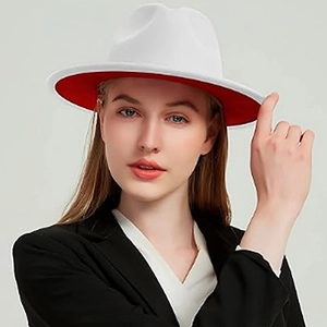 Detail of the high-contrast white wool fedora with a vibrant red underbrim