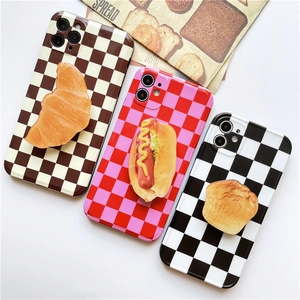 Macro shot of 3D realistic food bread charm on a trendy checkered phone socket grip