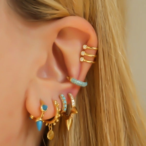 Chic S925 gold-plated earrings set with turquoise stones and zircons on ear model
