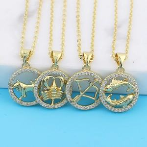 Gold zodiac sign necklaces with rhinestones featuring Taurus, Scorpio, Sagittarius, and Pisces