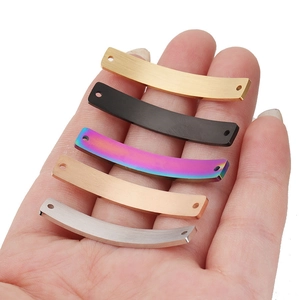 Curved stainless steel rectangular connector bars in five colors held in hand