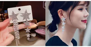 Asymmetric S925 star tassel earrings featuring pearls and sparkling zircon accents