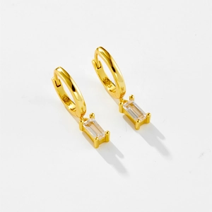 Macro detail of S925 sterling silver hoop earrings with rectangular cubic zirconia