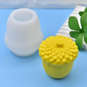 DIY pine cone silicone mold for candles and soaps with yellow textured pine cone finished product