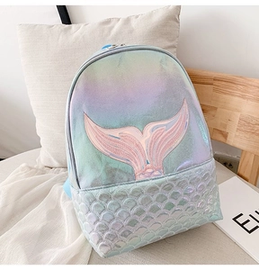 Close-up of laser holographic mermaid backpack with iridescent scales and tail embroidery