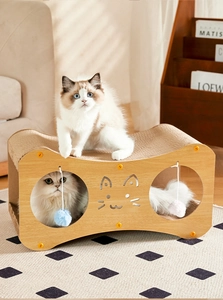 Detail of double-layer wooden cat house with corrugated scratcher and plush balls