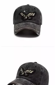 Detail of vintage grey washed cotton baseball cap with eagle embroidery and star accents
