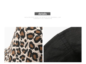 Detalle de tela con estampado de leopardo y costuras de lona negra en el sombrero reversible