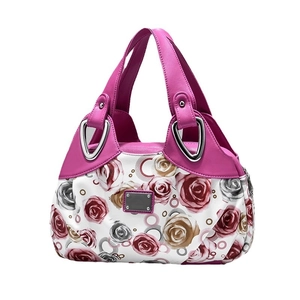 Fashionable floral tote bag with rose patterns and purple handles on white background