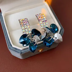 Sparkling silver square stud earrings with cascading blue crystal hearts and tassels