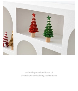 Miniature felt and wood Christmas tree ornaments on white geometric minimalist display