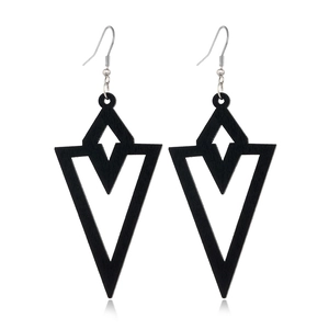 Fashionable black hollowed-out geometric wooden earrings for women on white background