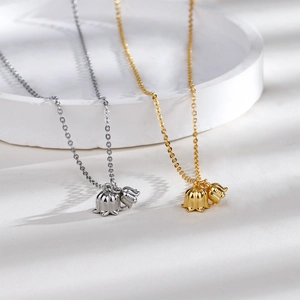 Detailed view of lily of the valley pendant with S925 hallmark on polished silver surface