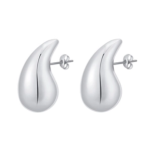 Macro detail of silver drop earrings showing polished mirror finish and stud closure