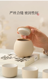 Close-up of beige ceramic tea canister with non-woven fabric seal for airtight storage